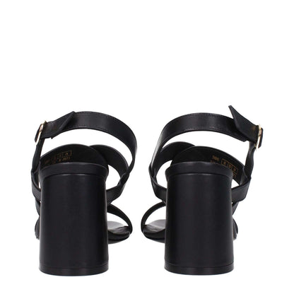 Stuart Weitzman Black Leather Platform Sandals with open toe and buckle closure, featuring a 7.5 cm mid heel, rear view.