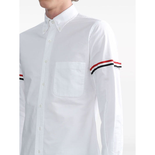Close-up of Thom Browne Shirts White with classic collar and RWB stripe grosgrain loop tab on sleeve.