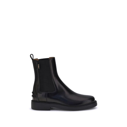 Tod's Black Calf Leather Bos Taurus Chelsea Boots with elastic inserts and rubber sole featuring embossed pebbles for comfort and grip.