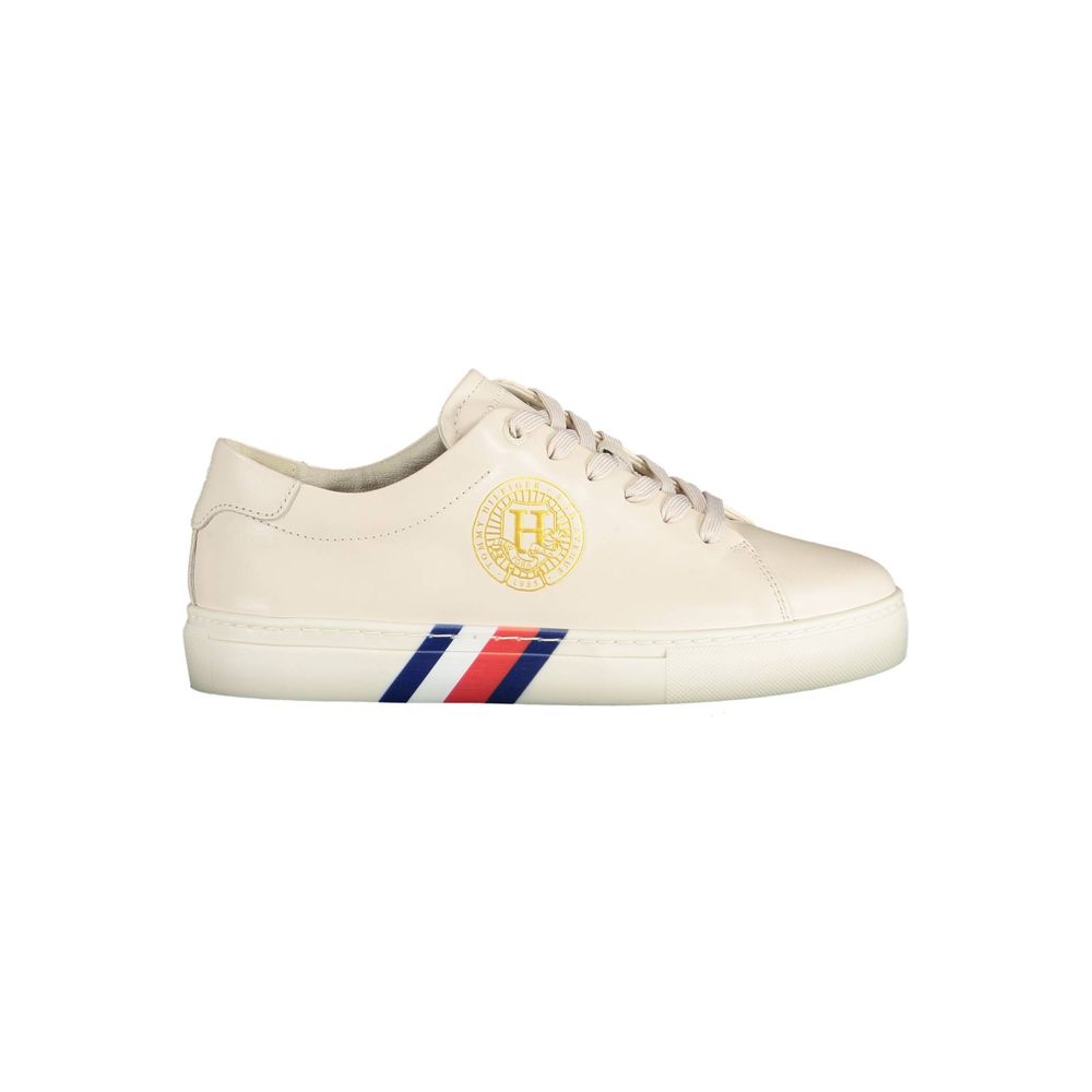 Tommy Hilfiger Beige Leather Women Sneaker with iconic logo, contrasting details, crafted for style and comfort in urban settings.