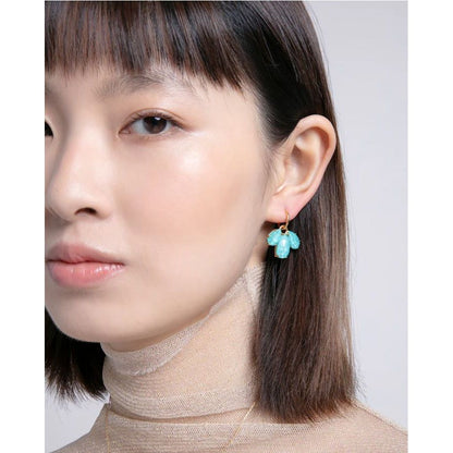 Woman wearing VICEROY JEWELS Mod. 13191E100-93 silver earrings with turquoise stones, showcasing elegant design for ladies.