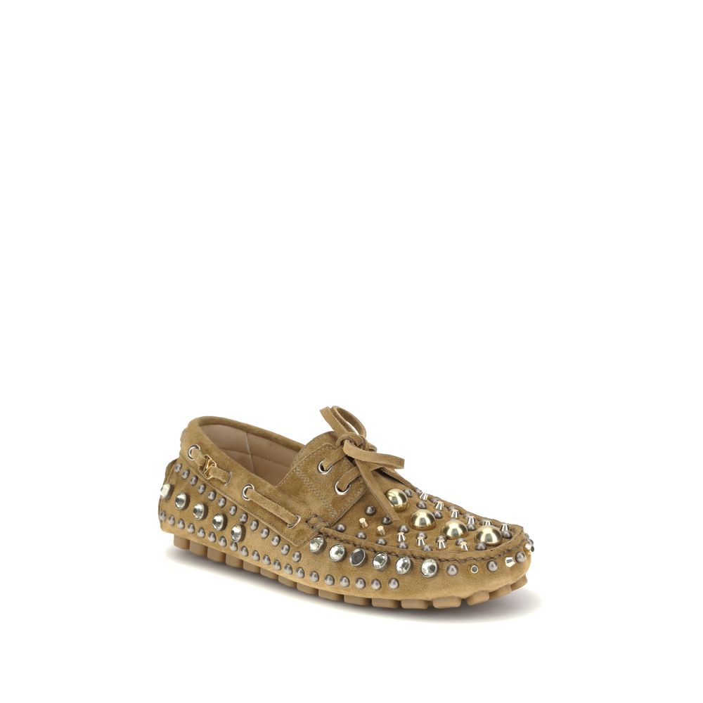 Valentino Garavani Beige Calf Leather Bos Taurus Slip-On Loafers with studs and rhinestones, classic and contemporary design.