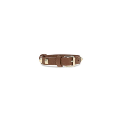 Valentino Garavani Brown Metal Bracelet with rockstuds and buckle closure, showcasing a chic leather design for AW25 season.