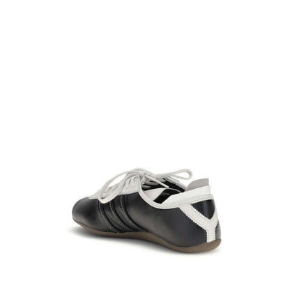 Y-3 Black Calf Leather Bos Taurus Low Top Sneakers with lace-up closure and striped detail, featuring a flat rubber sole, rear view.