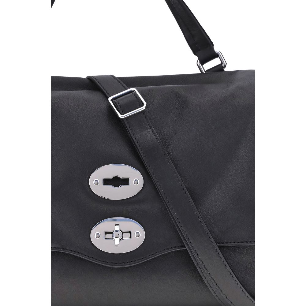 Close-up of Zanellato Black Calf Leather Bos Taurus Handbag with silver twist-hook closure and black shoulder strap.