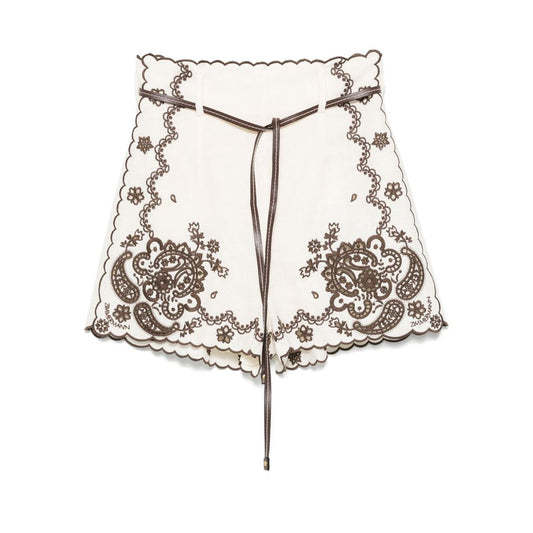 Zimmermann Ascension Shorts in light beige with detachable belt, scallop edge, and embroidery, ideal for stylish summer wear.